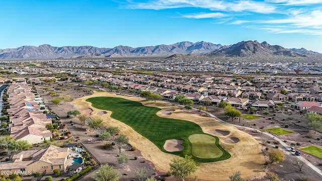 birds eye view of property with a mountain view