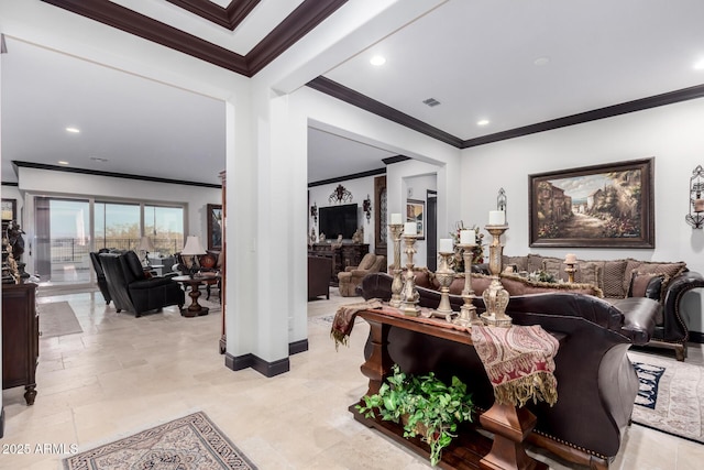 living room featuring crown molding