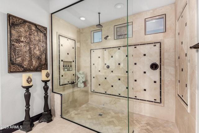 bathroom with a tile shower