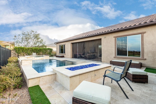 view of swimming pool featuring an in ground hot tub, a patio, and a fire pit