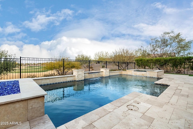 view of pool featuring a patio area, pool water feature, and an in ground hot tub