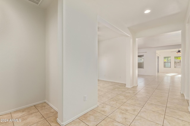 spare room featuring recessed lighting, ceiling fan, baseboards, and light tile patterned floors