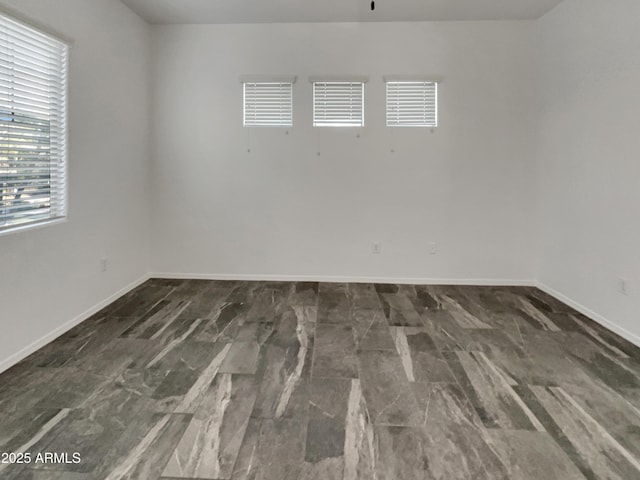 empty room with baseboards