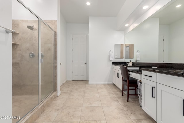 16860 W Soft Wind Dr, Surprise, AZ 85387 - full bathroom with a stall shower, recessed lighting, and double vanity