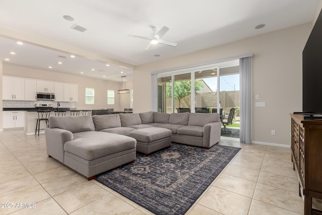 16860 W Soft Wind Dr, Surprise, AZ 85387 - living area featuring plenty of natural light, ceiling fan, light tile patterned flooring, recessed lighting, and baseboards