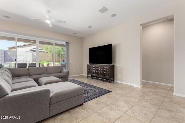 16860 W Soft Wind Dr, Surprise, AZ 85387 - living room featuring a ceiling fan, baseboards, and light tile patterned floors