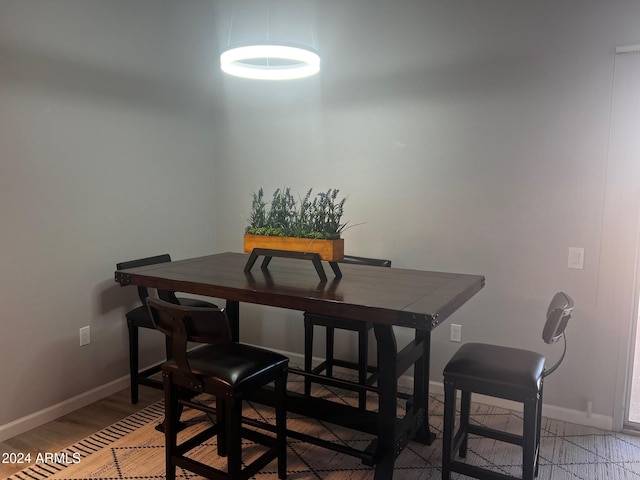 dining area with hardwood / wood-style floors