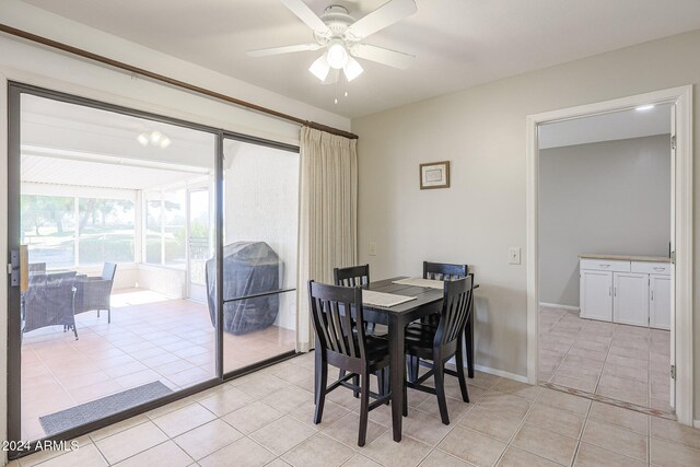 dining area featuring ceiling fan and light tile patterned floors