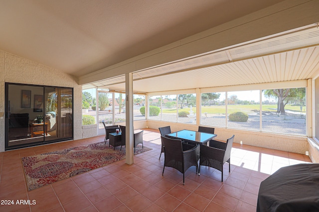 sunroom / solarium with vaulted ceiling