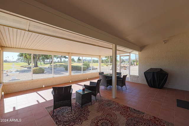 sunroom with lofted ceiling