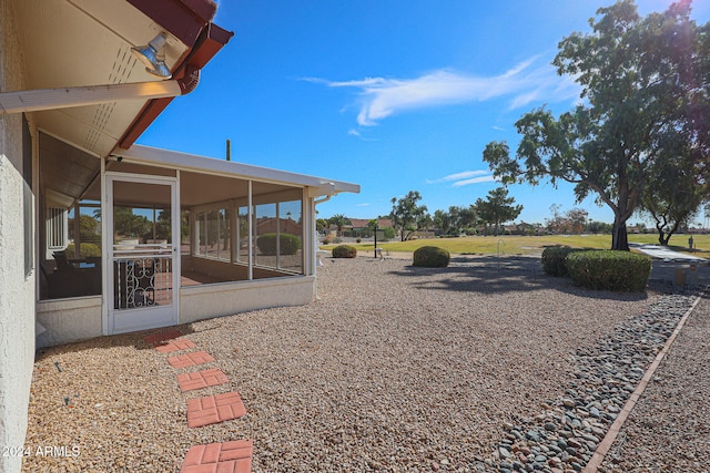 view of yard with a sunroom