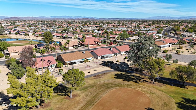 drone / aerial view featuring a water and mountain view