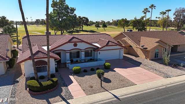 view of front of property featuring a garage and a front yard