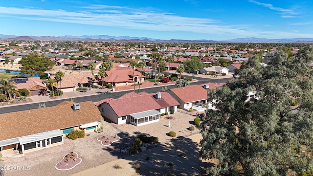 birds eye view of property with a mountain view