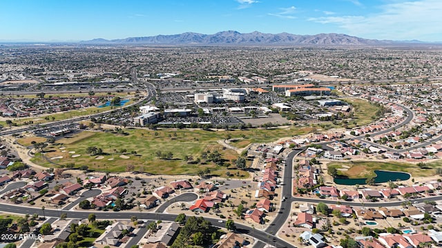 birds eye view of property with a water and mountain view