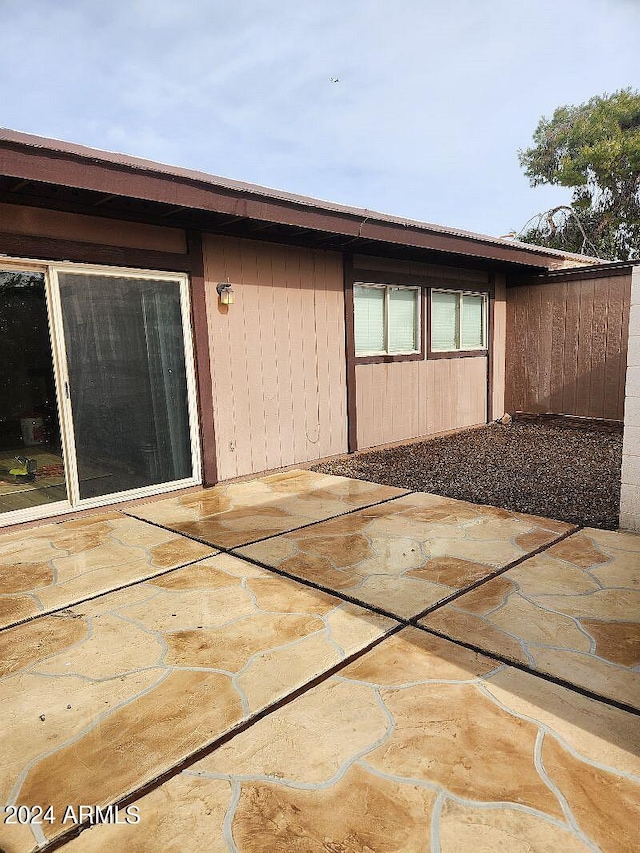 rear view of property with a patio area