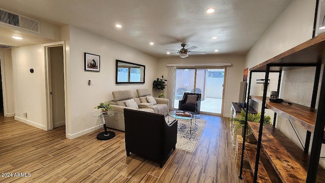 living room featuring ceiling fan