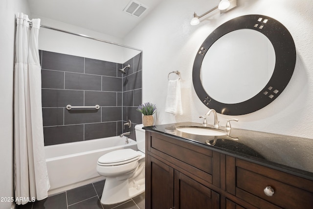 full bathroom featuring toilet, tile patterned floors, vanity, visible vents, and shower / tub combo with curtain