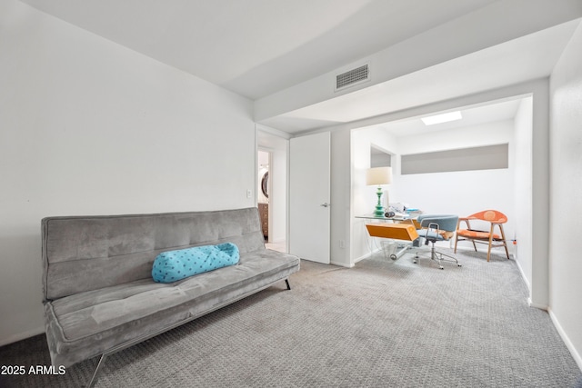 living area featuring light colored carpet