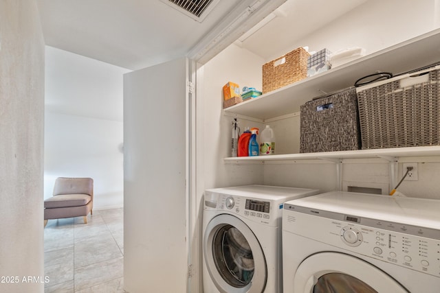 laundry area with light tile patterned flooring, laundry area, visible vents, and separate washer and dryer