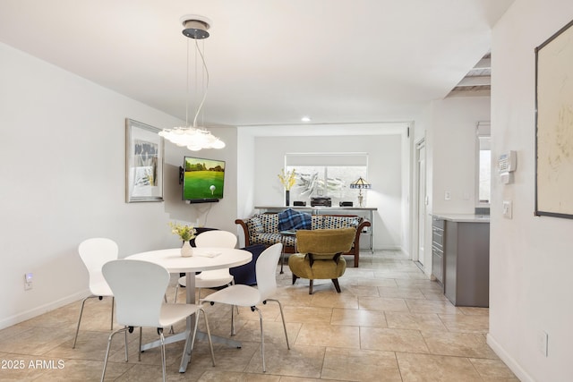 dining room featuring baseboards