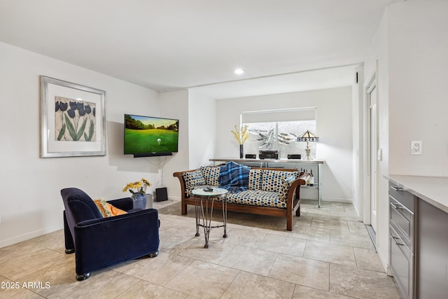 living room featuring recessed lighting, light tile patterned flooring, and baseboards