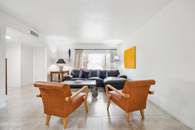 living room with visible vents and baseboards