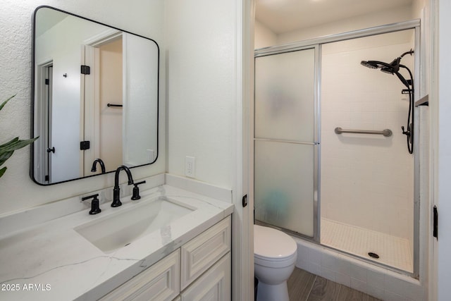 1540 E Glencove St, Mesa, AZ 85203 - full bath featuring a stall shower, toilet, vanity, and wood finished floors