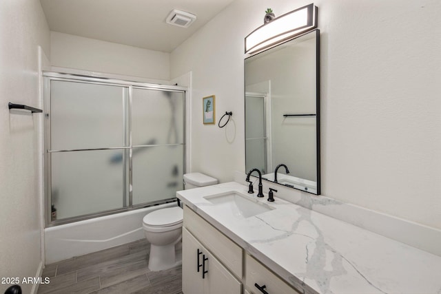 1540 E Glencove St, Mesa, AZ 85203 - full bath featuring toilet, vanity, combined bath / shower with glass door, and wood finished floors
