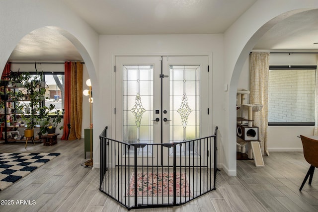 1540 E Glencove St, Mesa, AZ 85203 - entryway featuring light wood-style flooring, arched walkways, and baseboards