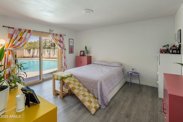 1540 E Glencove St, Mesa, AZ 85203 - bedroom featuring access to exterior, wood finished floors, and baseboards