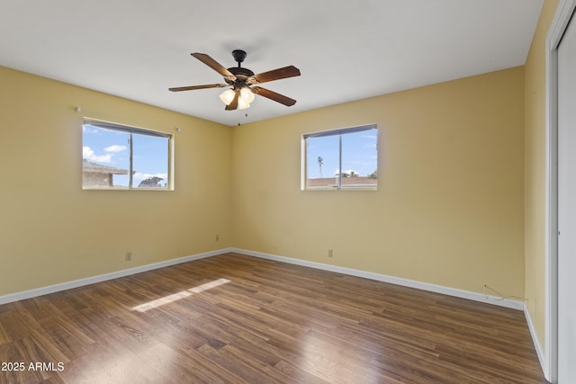 6217 E Dodge St, Mesa, AZ 85205 - unfurnished room with healthy amount of natural light, baseboards, and wood finished floors