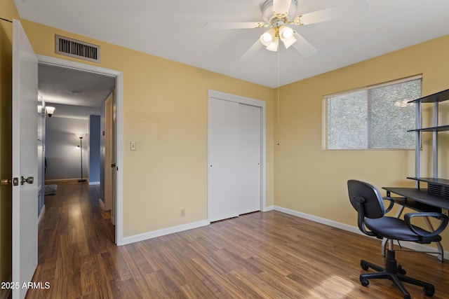 6217 E Dodge St, Mesa, AZ 85205 - home office with wood finished floors, ceiling fan, and baseboards