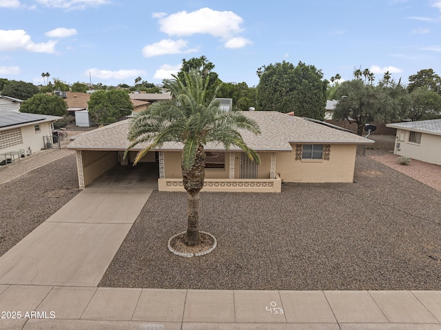 6217 E Dodge St, Mesa, AZ 85205 - view of front facade with driveway and a carport