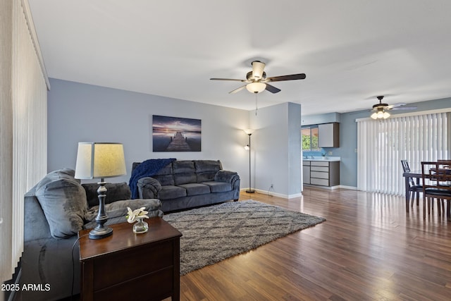 6217 E Dodge St, Mesa, AZ 85205 - living room with ceiling fan, wood finished floors, and baseboards