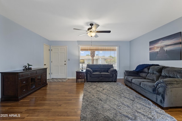6217 E Dodge St, Mesa, AZ 85205 - living room featuring ceiling fan, dark wood-style flooring, and baseboards