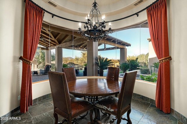 dining area featuring a chandelier