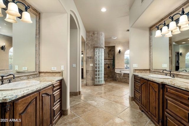 bathroom featuring vanity and plus walk in shower