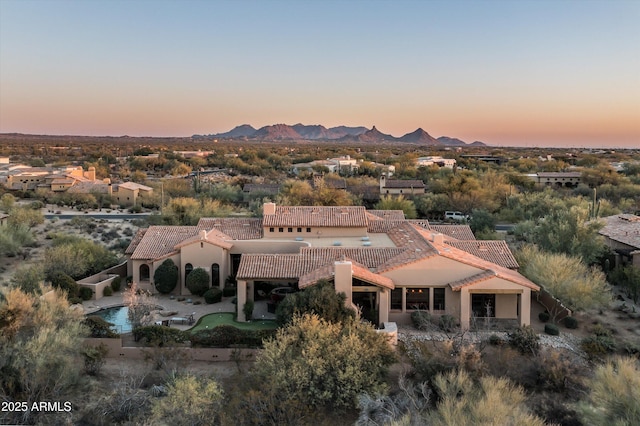 aerial view at dusk with a mountain view