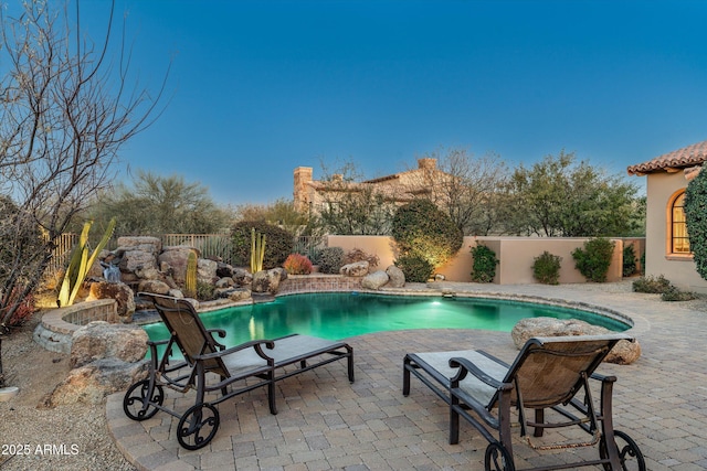 view of pool featuring a patio