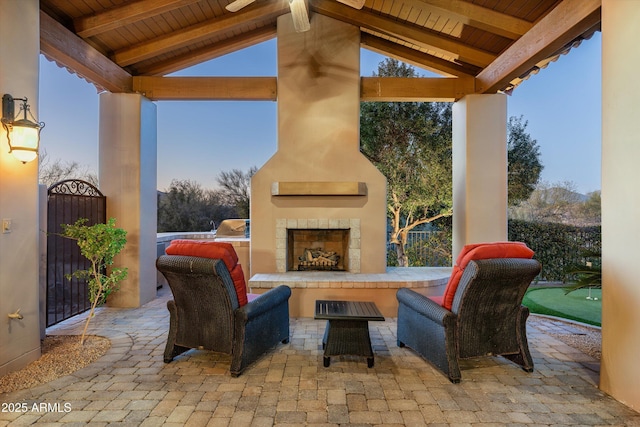 view of patio with a gazebo and a large fireplace