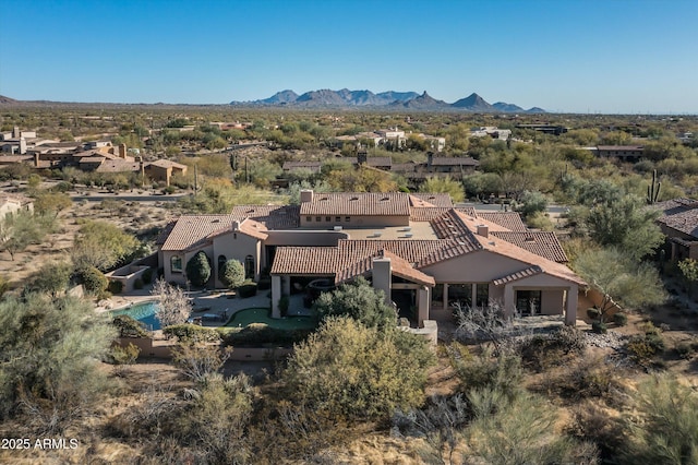 drone / aerial view featuring a mountain view