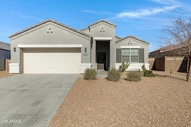 29402 W Mitchell Ave, Buckeye, AZ 85396 - view of front of house with driveway, stucco siding, and an attached garage