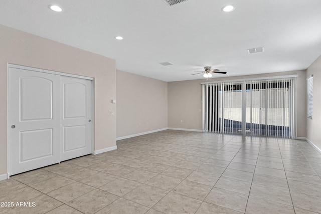 29402 W Mitchell Ave, Buckeye, AZ 85396 - spare room with a ceiling fan, baseboards, light tile patterned floors, and recessed lighting