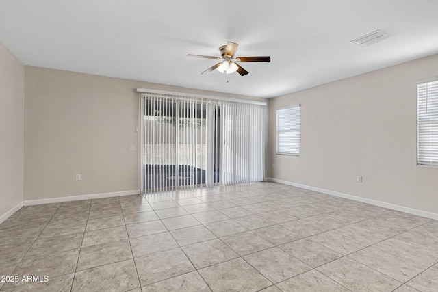 29402 W Mitchell Ave, Buckeye, AZ 85396 - unfurnished room with a ceiling fan, light tile patterned flooring, and baseboards
