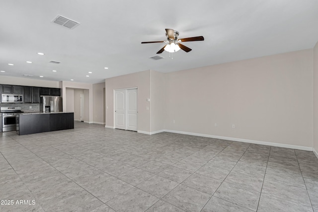 29402 W Mitchell Ave, Buckeye, AZ 85396 - unfurnished living room with ceiling fan, recessed lighting, baseboards, and light tile patterned flooring