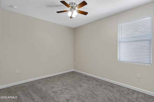 29402 W Mitchell Ave, Buckeye, AZ 85396 - carpeted spare room with ceiling fan, a smoke detector, and baseboards