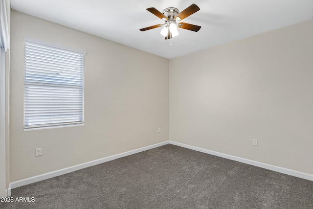 29402 W Mitchell Ave, Buckeye, AZ 85396 - unfurnished room featuring ceiling fan, dark colored carpet, and baseboards