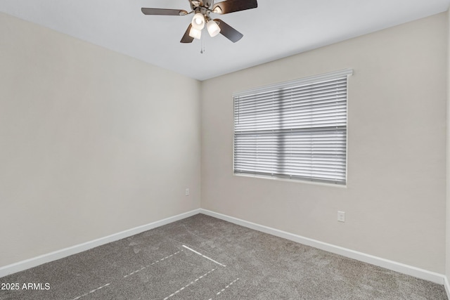 29402 W Mitchell Ave, Buckeye, AZ 85396 - empty room featuring dark colored carpet, baseboards, and a ceiling fan