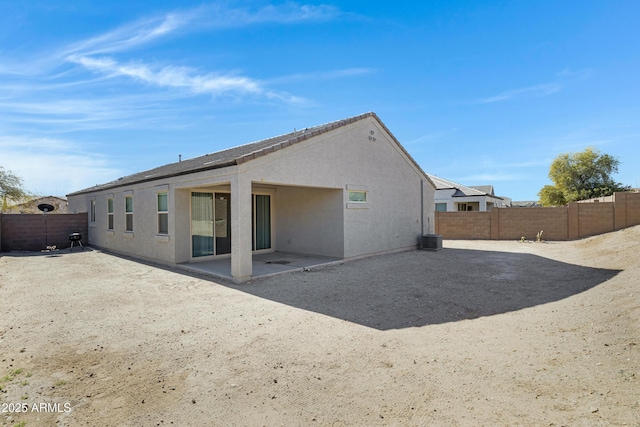 29402 W Mitchell Ave, Buckeye, AZ 85396 - rear view of property featuring a fenced backyard, a patio, stucco siding, and central AC unit